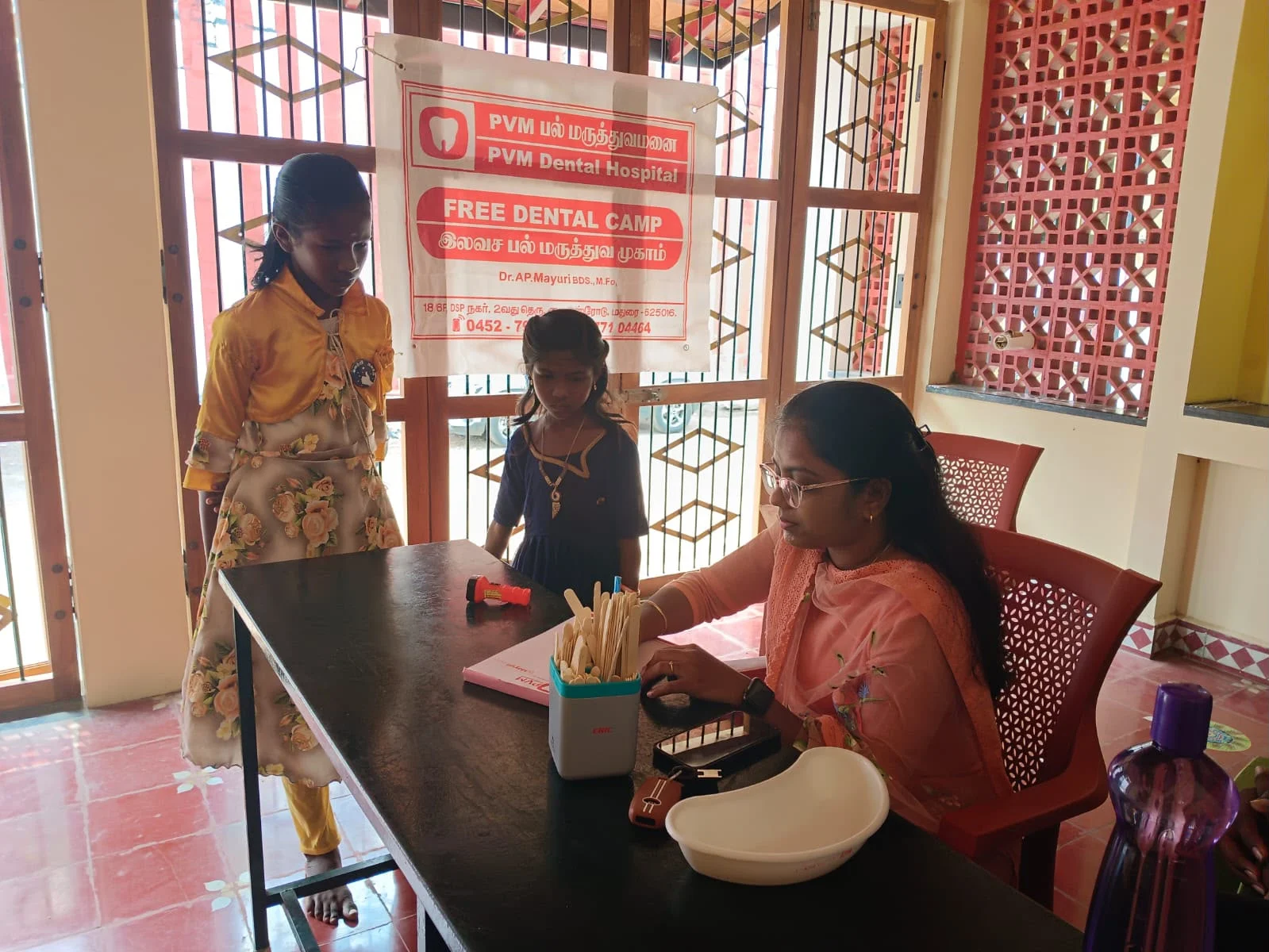 Dr. Mayuri AP providing oral health guidance to school children
